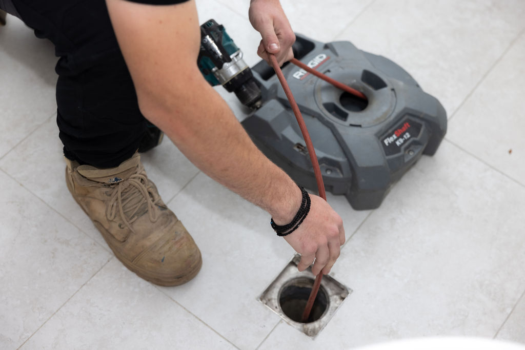 GSK Plumbing Solutions plumber using CCTV drain inspection equipment in Sydney
